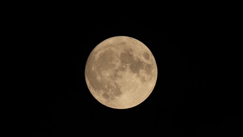 full moon disappears among the clouds