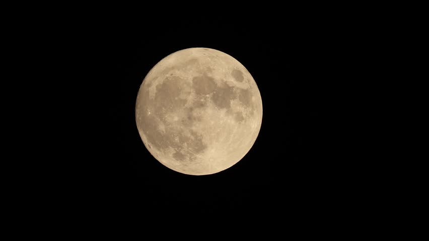 full moon disappears among the clouds