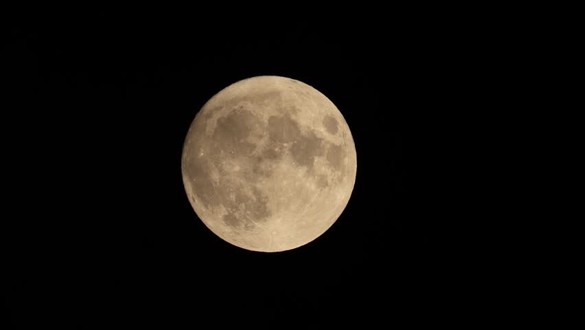 full moon disappears among the clouds