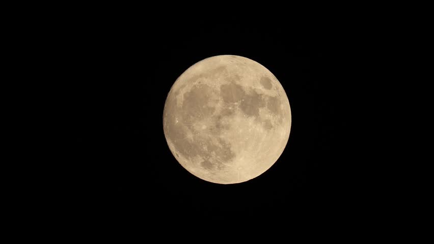 full moon disappears among the clouds