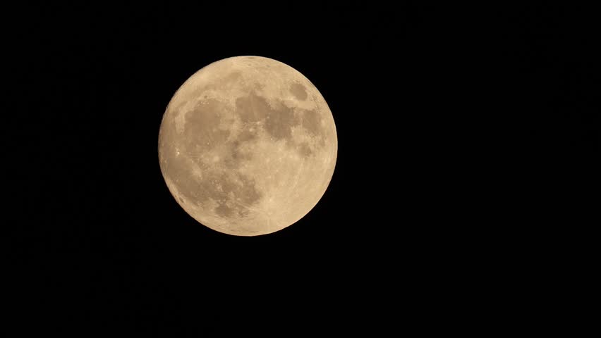 full moon disappears among the clouds