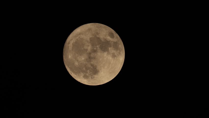 full moon disappears among the clouds