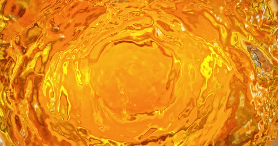 Super slow motion 1000fps video of fresh orange slices and crushed ice falling into rippling water, creating a sparkling splash, perfect for drink, cocktail and summer visuals.
