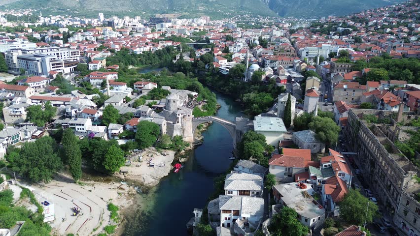 Historic Mostar Bridge Stari Most with Perfect Water Reflection on Neretva River in Bosnia and Herzegovina