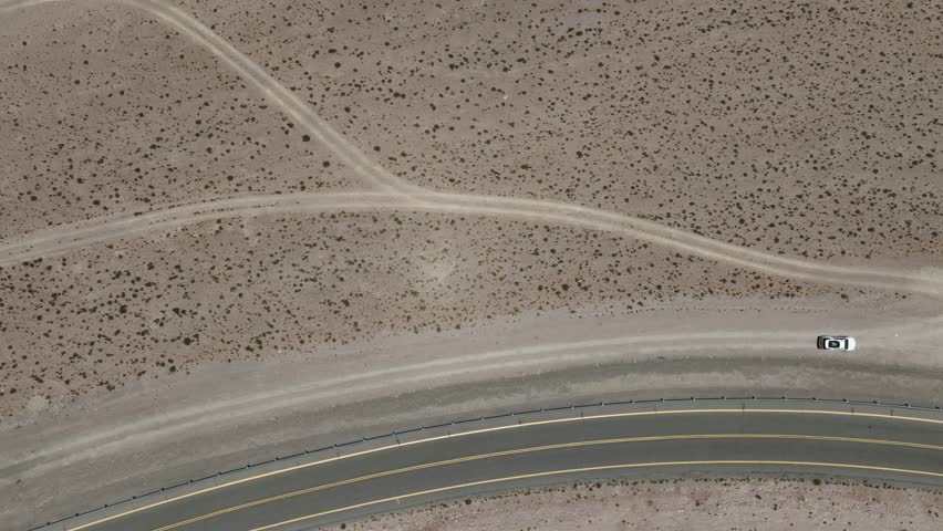 Atacama Desert, Chile. Car on the road. Aerial view by drone.