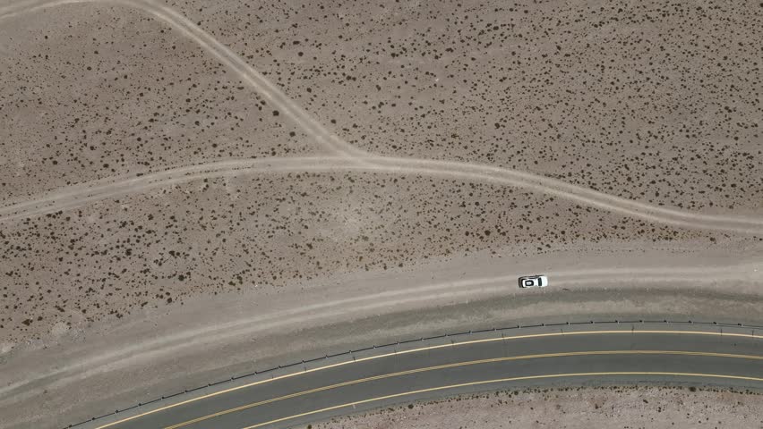Atacama Desert, Chile. Car on the road. Aerial view by drone.
