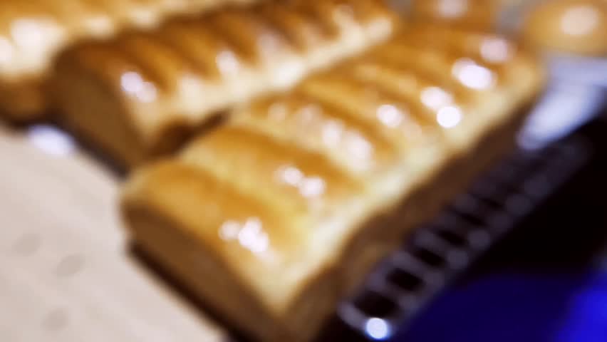 Freshly Baked Milk Bread Loaf with Golden Glaze in Bakery Display