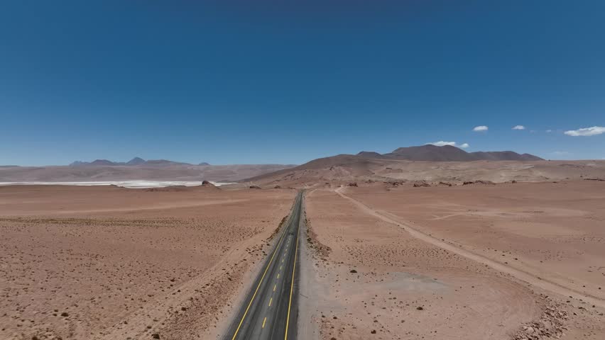 Atacama Desert, Chile. Car on the road. Aerial view by drone.