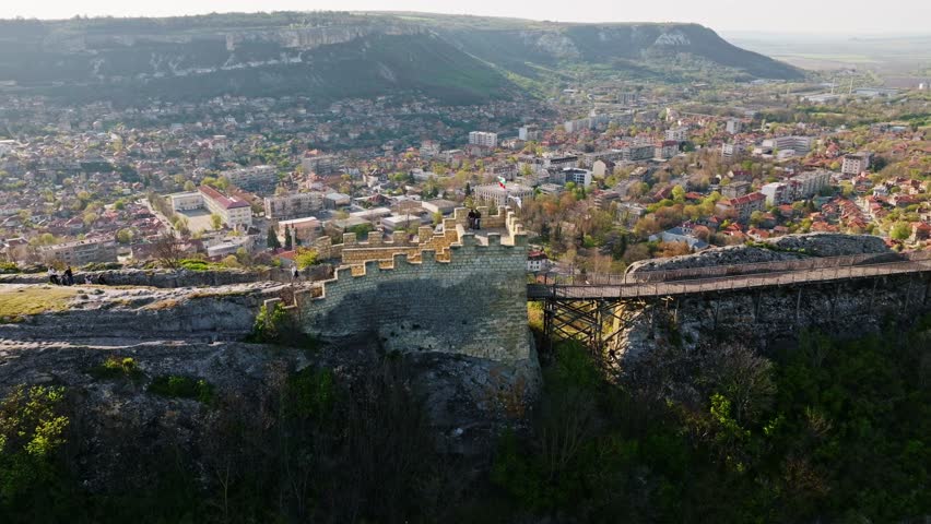 Ovech fortress viewpoint stone walls bridge Provadia city panorama Bulgaria medieval heritage travel landmark slow motion Balkans rocky cliff hillside urban landscape autumn overview scenic