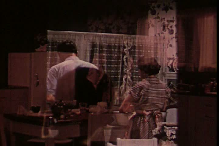 1950s - The kitchen is cleaned up while Tommy is in school and his laundry is done. | Shutterstock HD Video #4098688