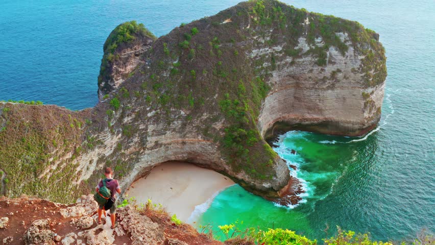 Travel people enjoy amazing view famous landmark and popular travel destination Kelingking beach Nusa Penida, Bali, Indonesia 4K