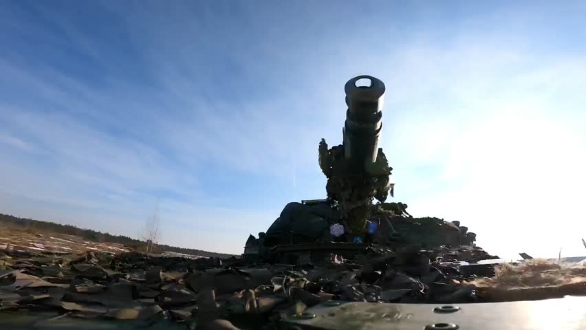 Tank Gun Barrel Framed Against Bright Winter Sky.