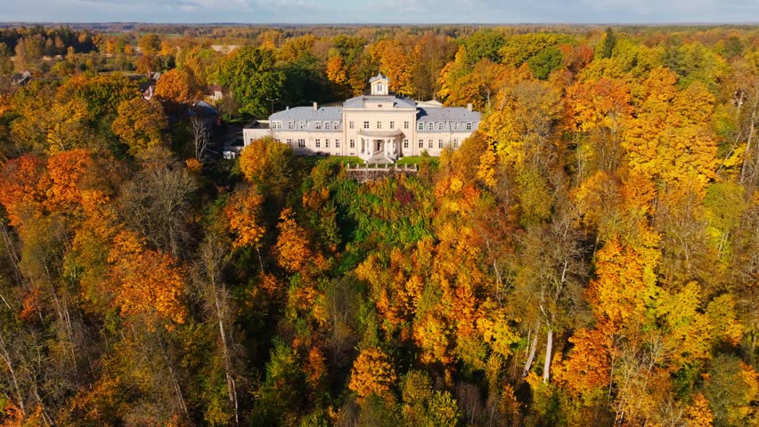Krimulda Manor Surrounded by Golden Autumn Forest in Sigulda Latvia Aerial View