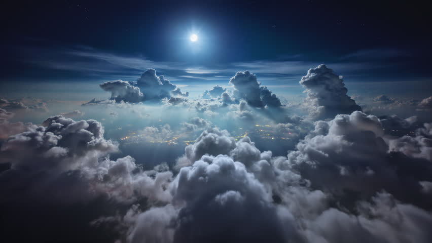Flying above moonlit cloudscape panorama, beautiful night aerial cloud timelapse, bright full moon shines through moving animated cumulus clouds with peaceful light rays, night city lights.