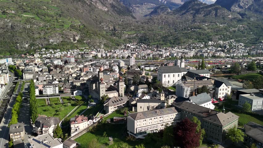 Brig Swiss holiday town below Alps Stockalper Palace Switzerland aerial drone landscape Simplon Pass