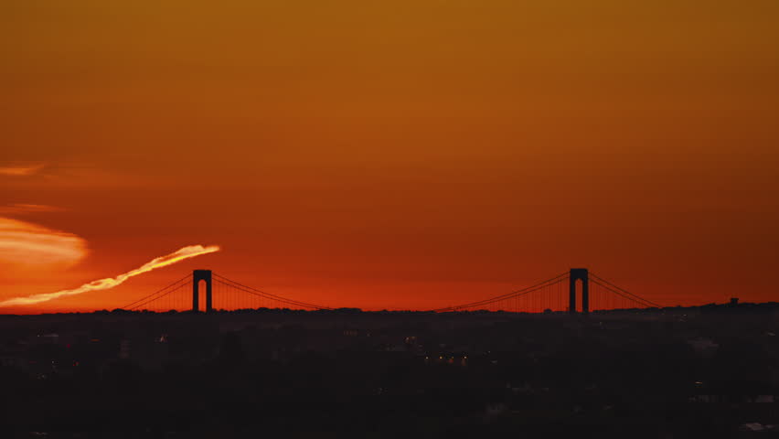 New York, NY, USA - Jun 6th 2026: sunrise over the Throgsneck Bridge in Queens NYC. 