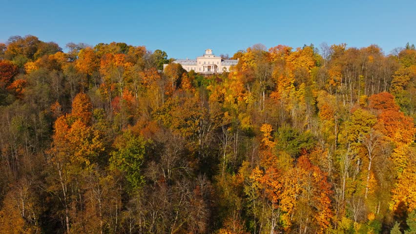 Historic Krimulda Manor Surrounded by Colorful Woodland in Autumn Latvia