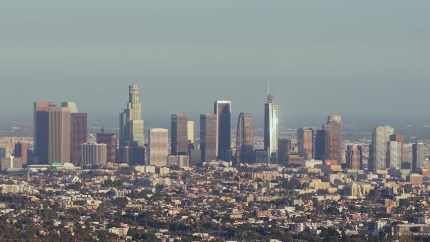 Downtown Los Angeles skyline featuring Wilshire Grand Center and U.S. Bank Tower during a clear day, financial district and urban landscape of California