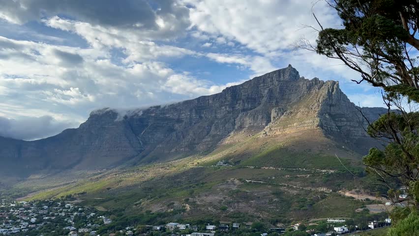 Table Mountain rising prominently above the Cape Town suburbs. South Africa.