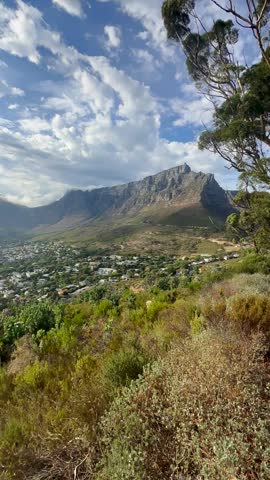 Table Mountain rising prominently above the Cape Town suburbs in South Africa.