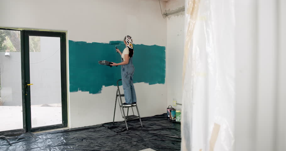 Woman, roller and painting with ladder for home renovation, interior design and property makeover. Back, creative person and art tools in living room with house improvement, diy or remodeling project