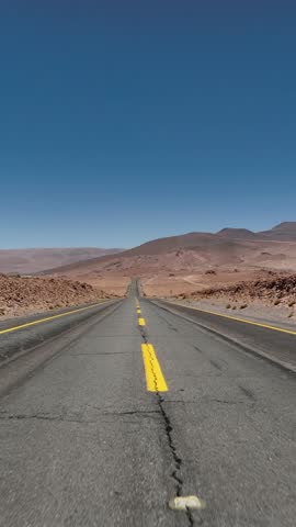 Atacama Desert, Chile. Car on the road. Aerial view by drone in vertical video