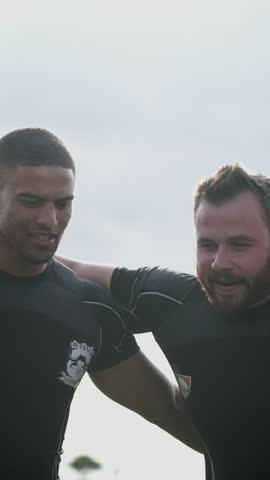 Huddle, rugby and training with people outdoor together for solidarity, teamwork or unity. Fitness, sports and strategy with player group at competition, game or match for motivation and support