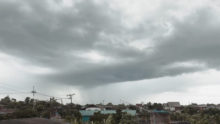 Rain is  falling in  rural with clouds background, Chiangmai Thailand.