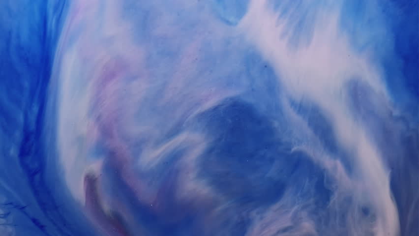 Paint particles. Marble wave. Defocused blue white color ink in water liquid flow emulsion splash spreading on abstract art background.