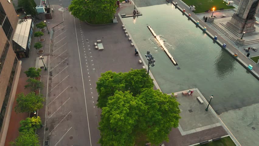 The central public space within the confines of downtown that exhibit greenery, park benches, tables, an expansive fountain, and a landmark dedicated to those that served.