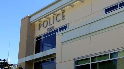 WHITTIER/USA, CA: February 23, 2013- Low angle close up shot of a generic looking modern police station circa 2013 in Whittier. Clip features a generic police station for documentaries or news.