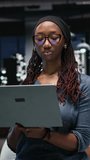 Vertical video Programmer in office developing complex machine learning algorithms simulating human brain thought processes. IT professional deploys AI tools, performing software quality assurance - Powered by Shutterstock - Get 15% off with code: PIKWIZARD15