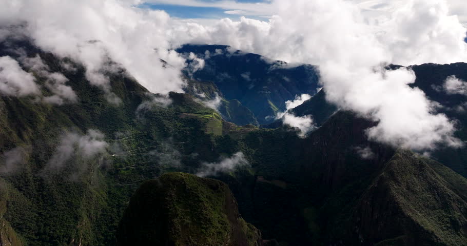 Machu Pichhu Inca citadel UNESCO site enshrouded by Andes mountain fog, aerial
