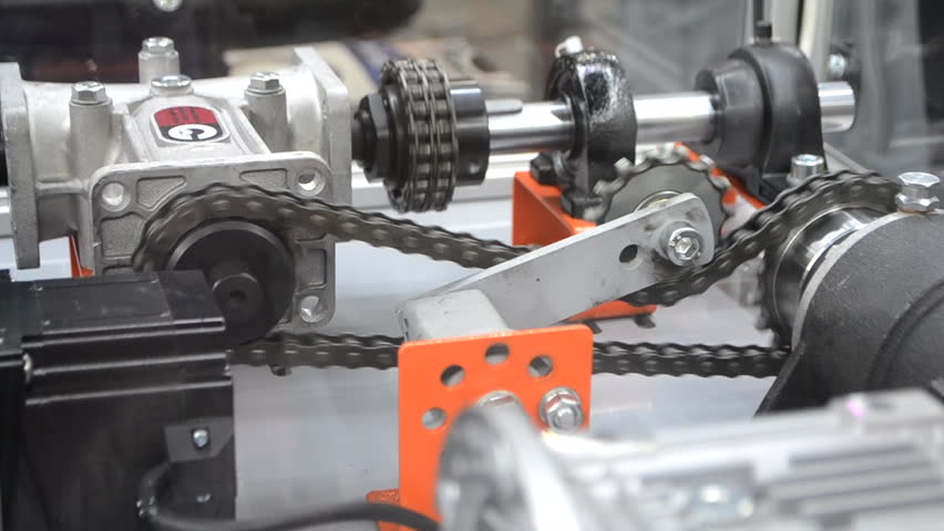 Industrial torque transmission mechanism, roller chains and sprockets for drive. Mechanical power transmission system. Drive sprockets and shafts. Drive roller chains for torque transmission. Industry