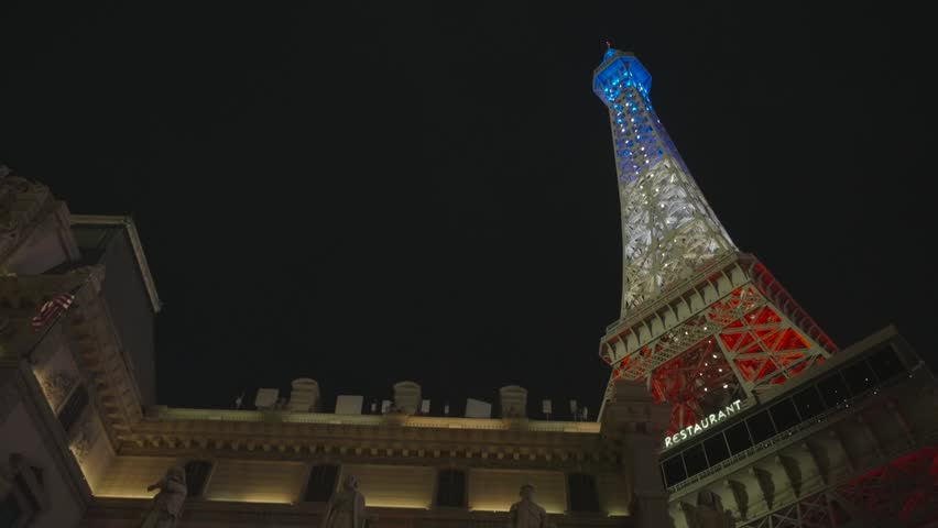 Las Vegas, Nevada - December 13, 2024: Low angle of fake Eiffel Tower with blue white red lights
