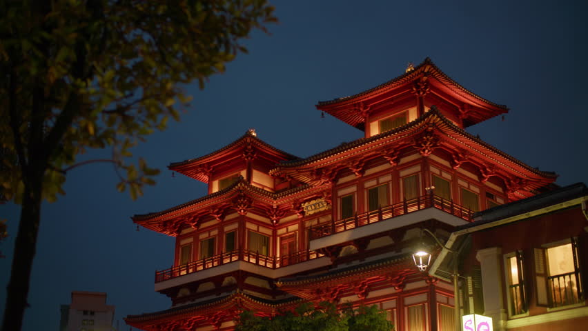 Buddha Tooth Relic Temple pagodas illuminated at night in Chinatown Singapore City beautiful urban architecture and tourism in Asia