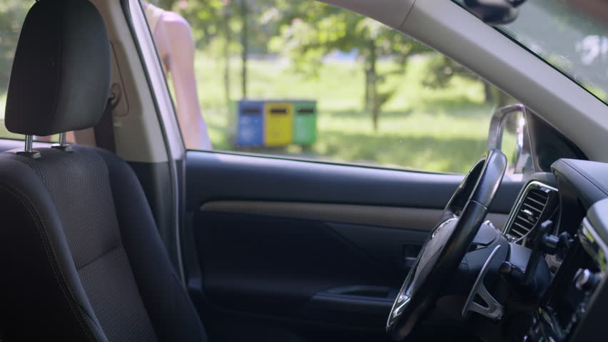 African American business woman opening door new luxury electric car fastening seat belt adjusting mirror safety female businesswoman driver buying automobile transport vehicle auto insurance purchase