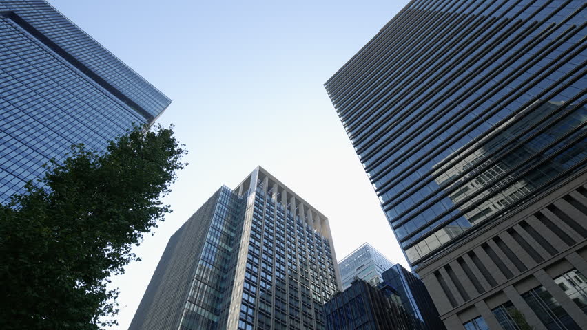 Impressive skyline of Tokyo financial district with towering glass offices.