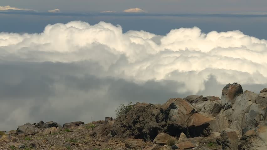 Dramatic Clouds Against Rocky Terrain In Haleakala National Park, Maui, Hawaii