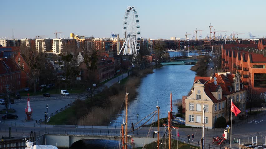 Podewils hotel and ferris wheel next to the canal in the old town. Gdansk, Poland.