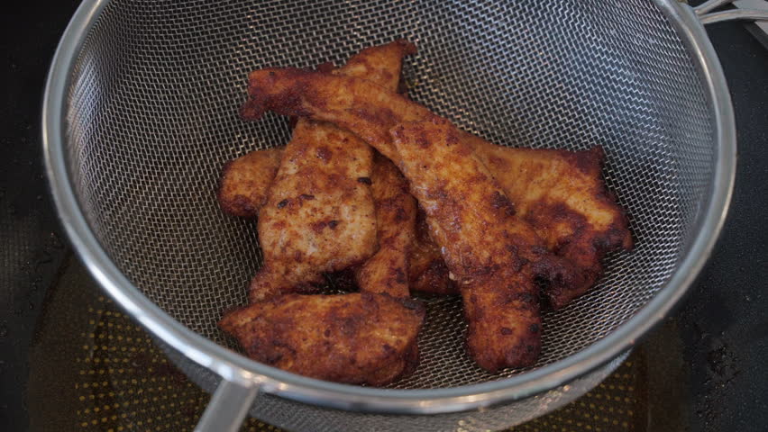 Fried chicken just cooked and placed in a basket