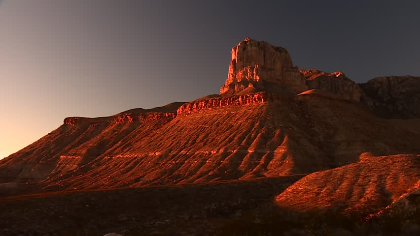 Static shot of El Capitan Peak illuminated by sunset sunset in Guadalupe Mountains National Park, Texas, USA.