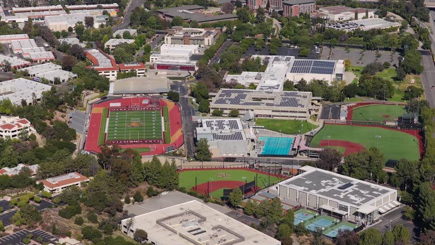 Sport facilities featuring football stadium, baseball field and swimming pool, modern infrastructure for student athletes in the USA