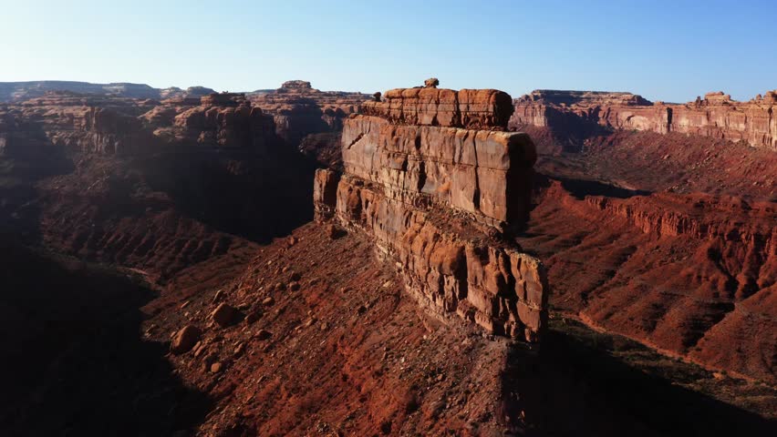 Valley of the Gods drone flyby of Battleship Butte near sunset.