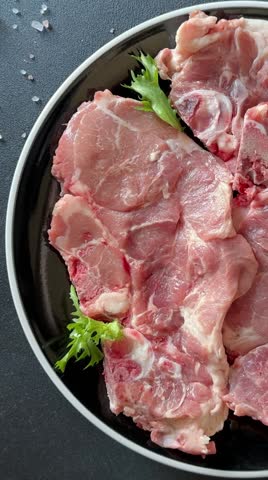 Pork steak raw meat lunch or dinner tasty snack fresh and delicious gourmet food background on the table rustic food top view copy space