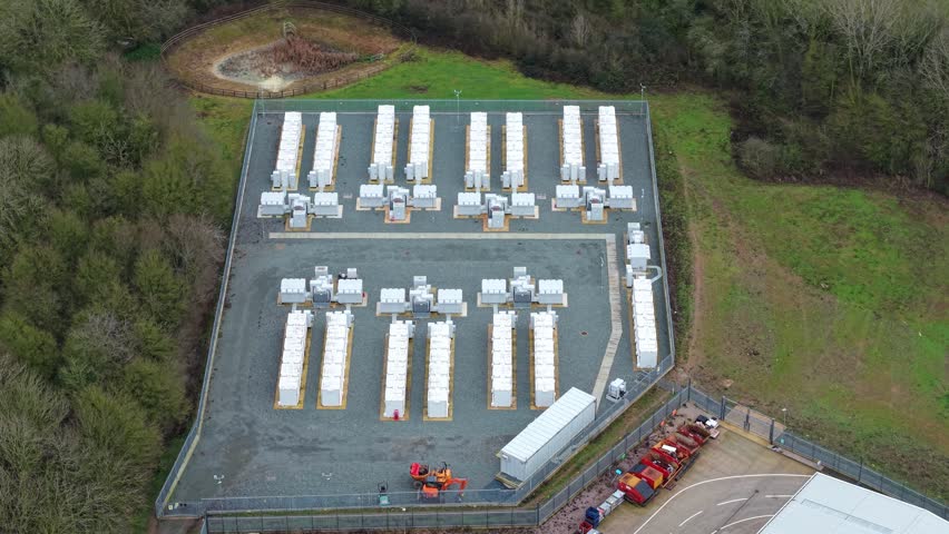 Drone shot of a modern clean tech power generation and battery storage facility in the British countryside
