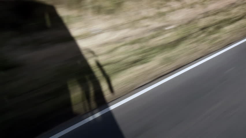 Shadow of a Passenger Bus Moving Along a Rural Road in Argentina - 4K
