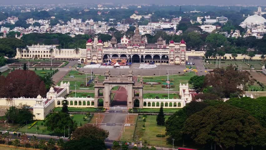 Mysuru palace with entrance arch, Shri Trinayaneswara Swami Temple, Shri Gayathri Devi Temple and Palace Garden at mysore, karnataka, india. day time, trucking shot, static shot, drone shot, 4k.
