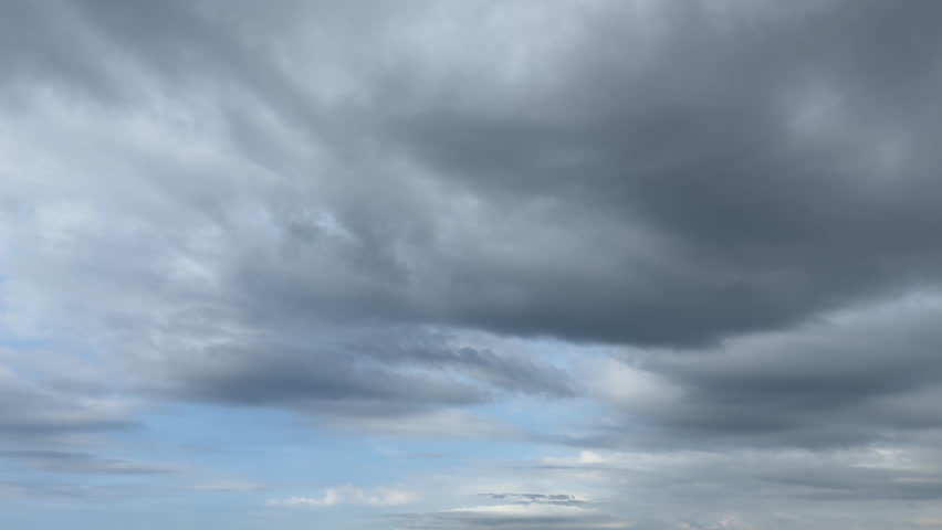 A peaceful blue sky landscape painted by flowing clouds