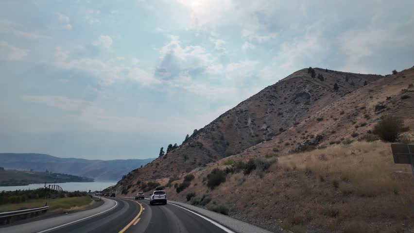 Landscape of mountain and road. Travel destination. Landscape route. Scenic nature autoroute. Rainy weather road among mountain. Road though mountain landscape.